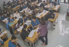 The teacher dangling shoeplay and dipping many times during class 9