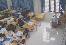 The teacher dangling shoeplay and dipping many times during class 19