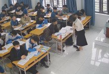 The teacher dangling shoeplay and dipping many times during class 22