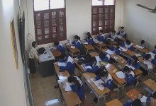 The teacher dangling shoeplay and dipping many times during class 25