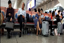 Lady give us a dangling text book at the railway station