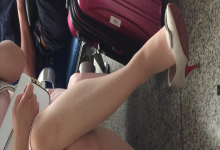 Girl dangling shoeplay when waiting for a train 12