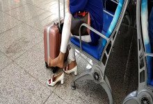 Lady dangling shoeplay when waiting for a train 39