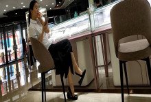 Lady dangling shoeplay when waiting for a train 49