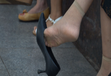 Get more closer to the middle lady's dangling feet