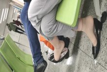 The lady dangling shoeplay when line up on the waiting hall 237