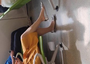 The lady in sexy nylon dangling shoeplay when waiting for a call