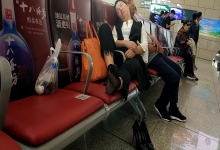 Lady remove heels sleeping at railway station lounge