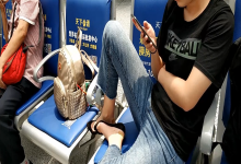 Girl remove heels and relax her tired feet on the chair when waiting for a train