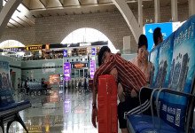 Girl remove shoes and put her tired feet on her BF's leg