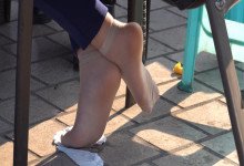 The lady remove shoes relax her tired feet when playing poker