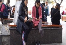 The middle age lady's remove heels relax her brown nylon feet