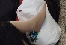 The lady remove shoes relax her tired feet when waitting for a train 50