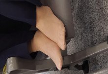 The lady remove shoes relax her tired feet when waitting for a train 61