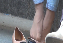 The lady remove shoes relax her tired feet when waitting for a train 72