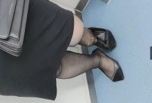 Girl in black nylon stand up dipping shoeplay on the subway