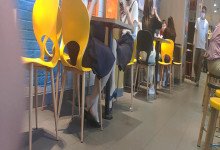 The girls dipping shoeplay under the table when having lunch 4