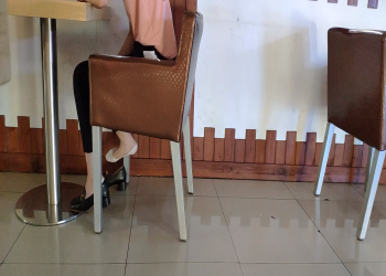 The girls dipping shoeplay under the table when having lunch 5
