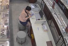 The jewelry store hostess in black nylon dipping shoeplay under the table 3