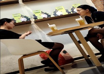 What are the two beauties talking about?