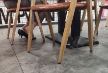 The beautiful girl shoeplay while eating