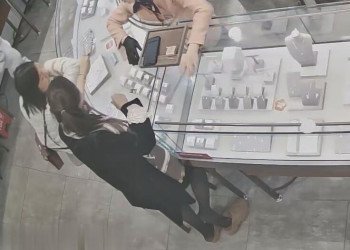 The beautiful woman in black stockings and sandals stand up shoeplay