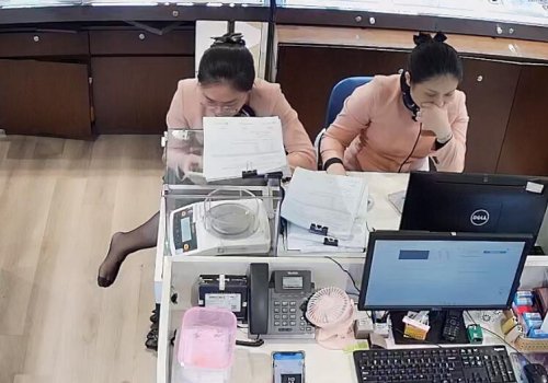 The jewelry store hostess in black nylon footmassage by herself