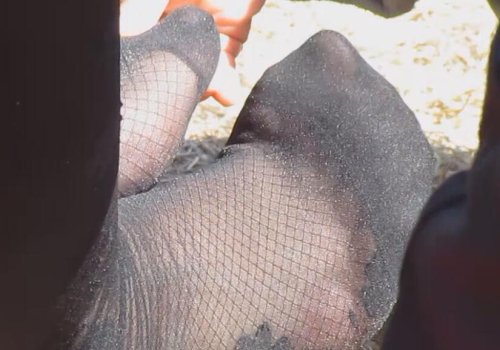 Who is touching her feet?