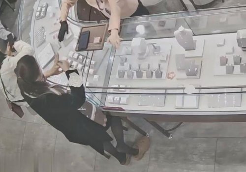 The beautiful woman in black stockings and sandals stand up shoeplay