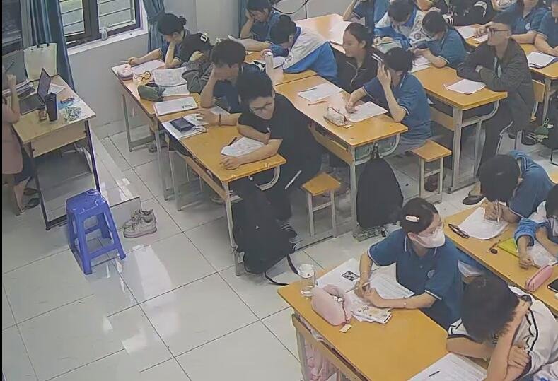 The teacher dangling shoeplay and dipping many times during class 55