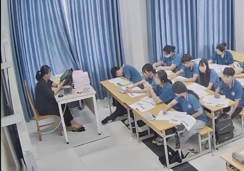 The teacher bare feet dipping shoeplay when having a lesson