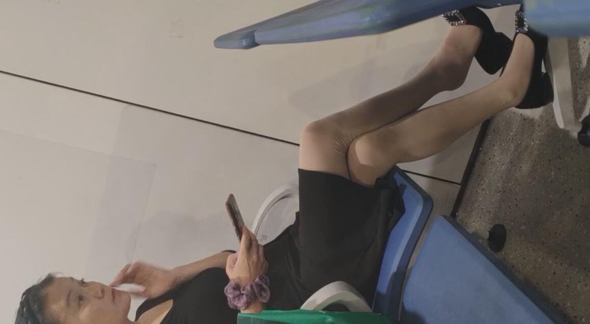 The female executive sitting on chair relaxing feet