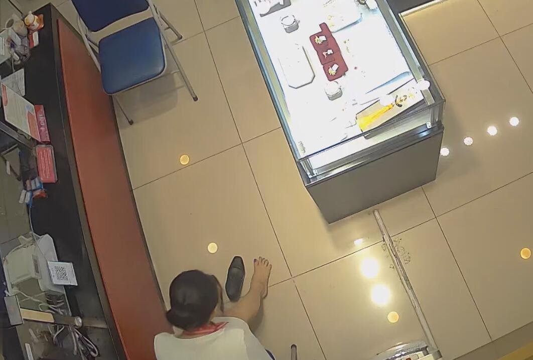 The jewelry store hostess in white dress great dangling shoeplay 40