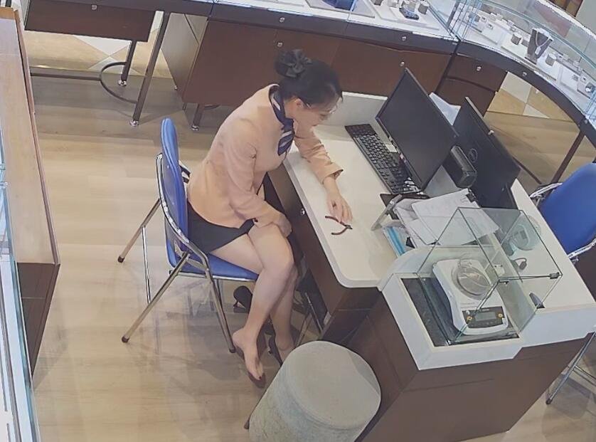 The jewelry store hostess bare feet dangling