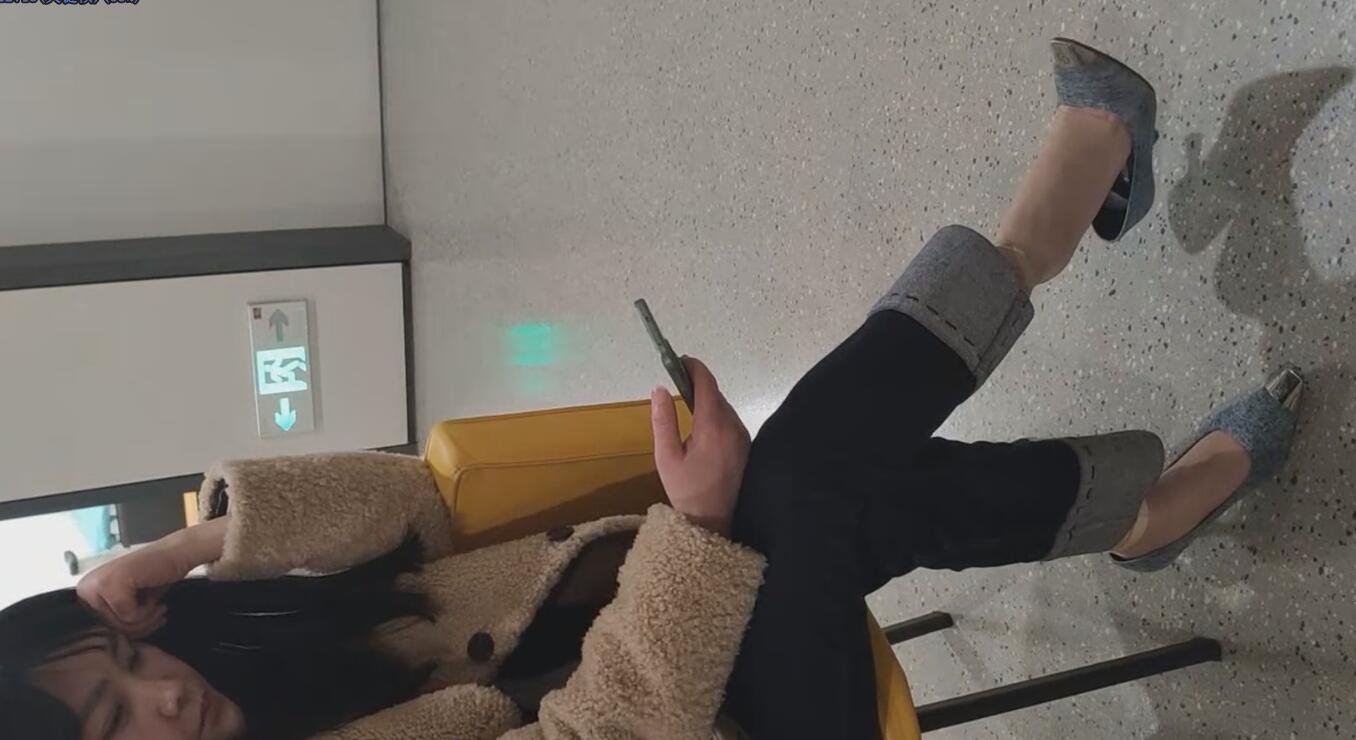 The pretty girl in brown heels  great dangling shoeplay