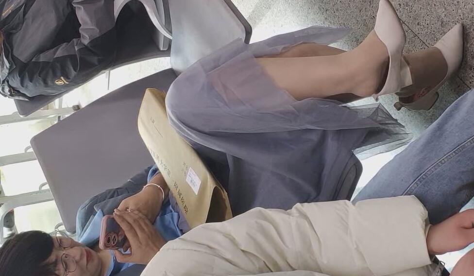 The office lady great dangling shoeplay at the airport terminal