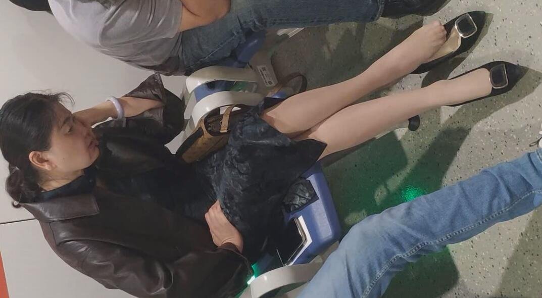 The lady in black heels dangling shoeplay when waiting for a call 5