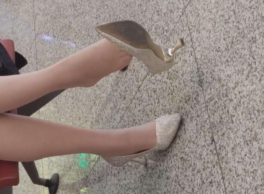 The lady in white heels dangling shoeplay when waiting for a call 11