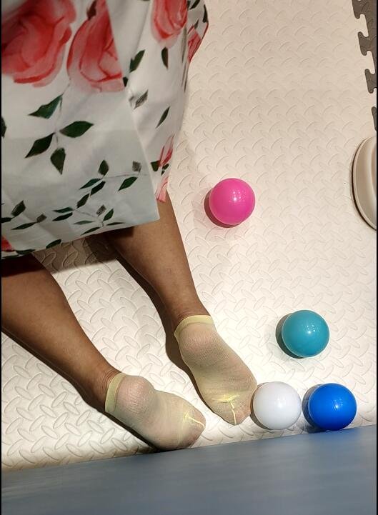 Beautiful stocking soles of young mother