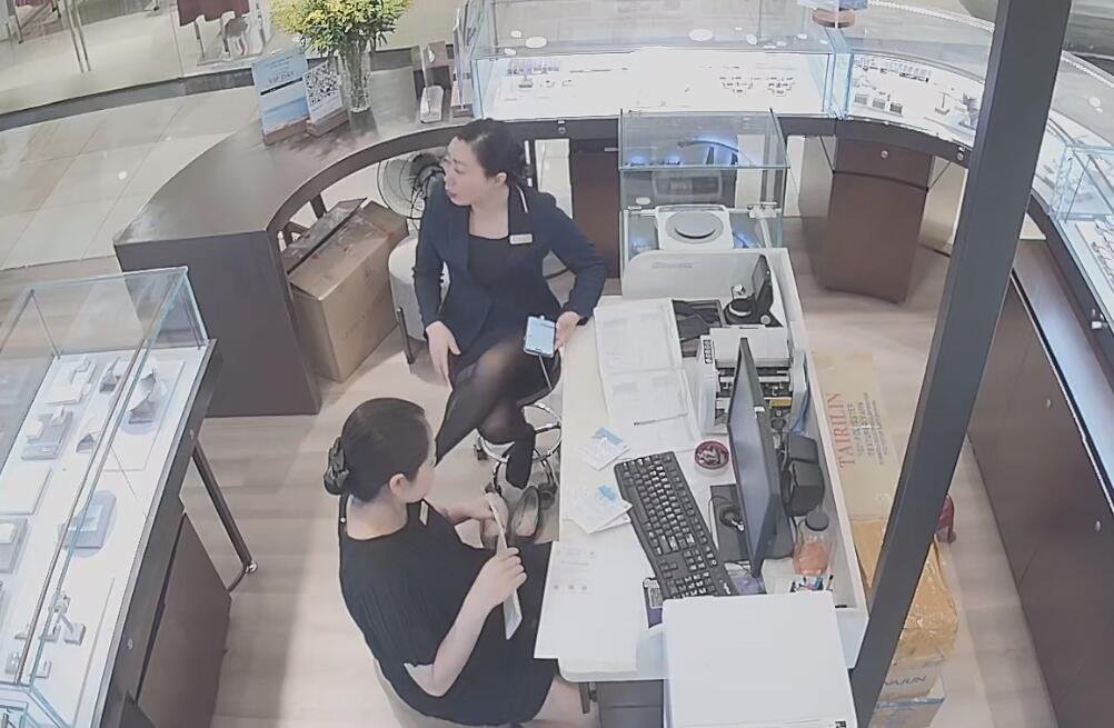 The jewelry store hostess show us her cute black nyon feet