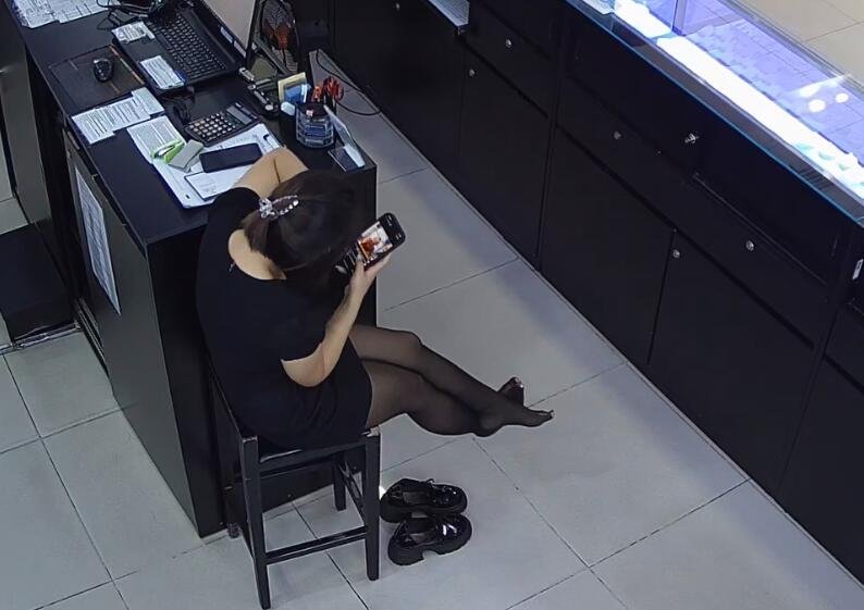 The jewelry store hostess in black nylon show us her cute feet! 262